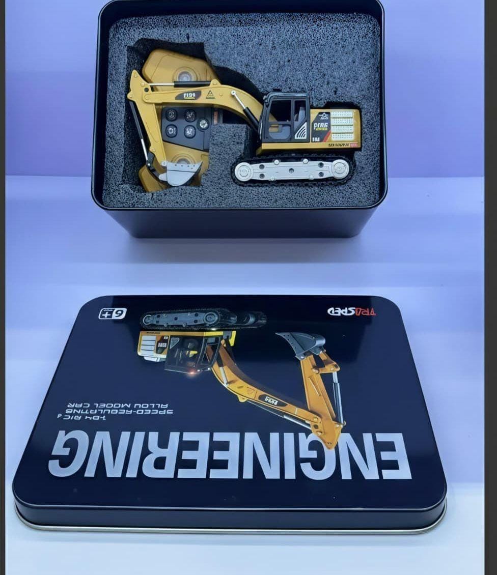 remote-controlled engineering vehicle toy packaged in a metal tin