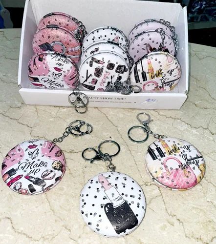 portable compact mirror decorated with a love-themed design.