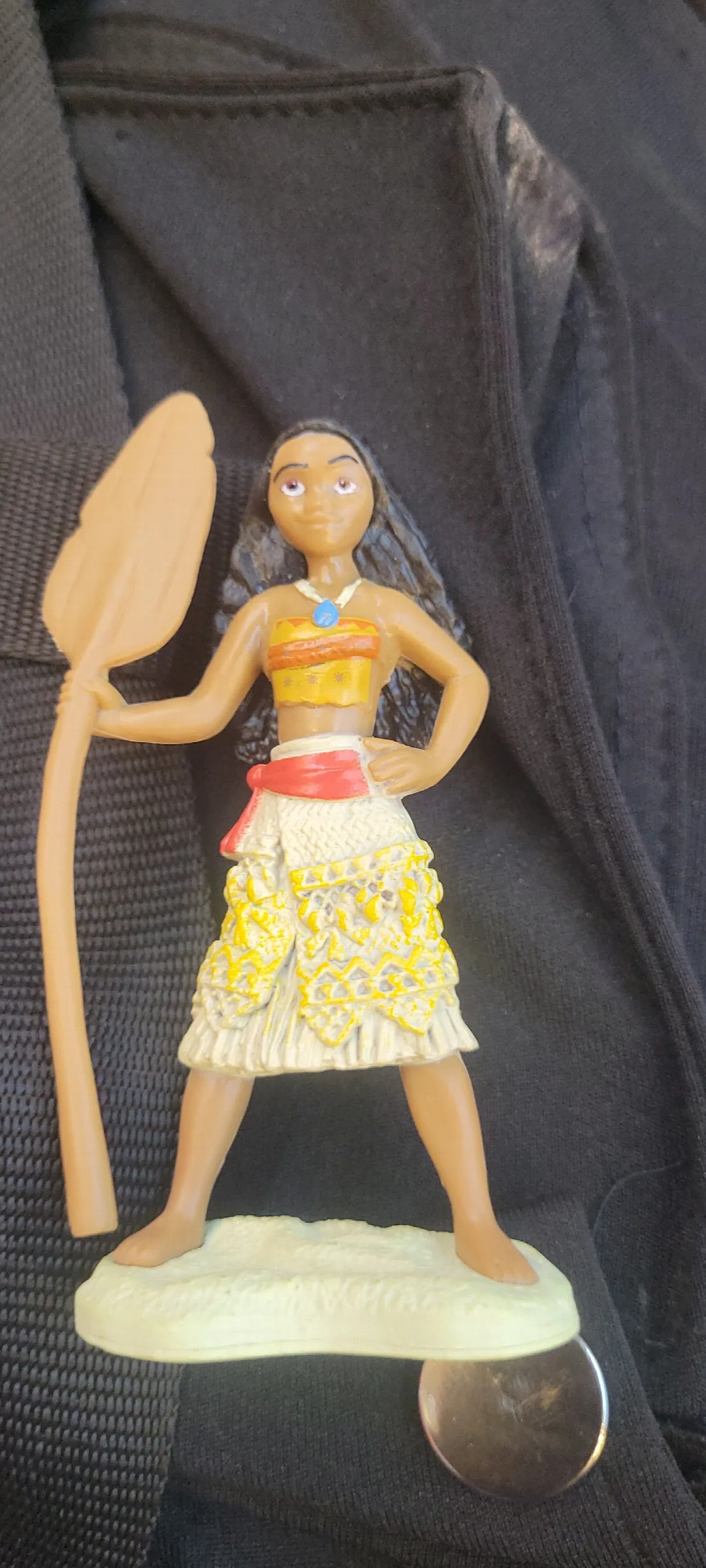 character is a Moana small action figure inspired by the popular animated film Disney's Moan