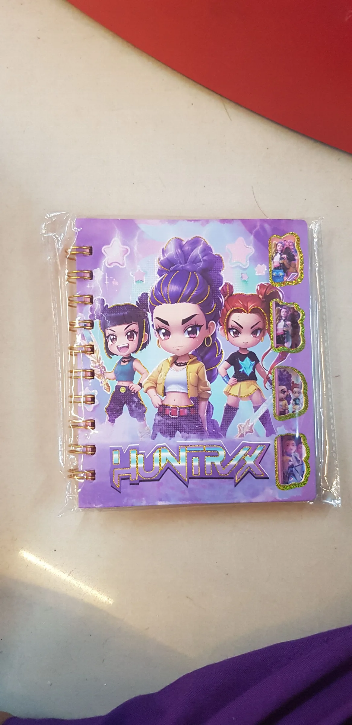 a K-Pop Demon Hunters Huntrix mini spiral notebook