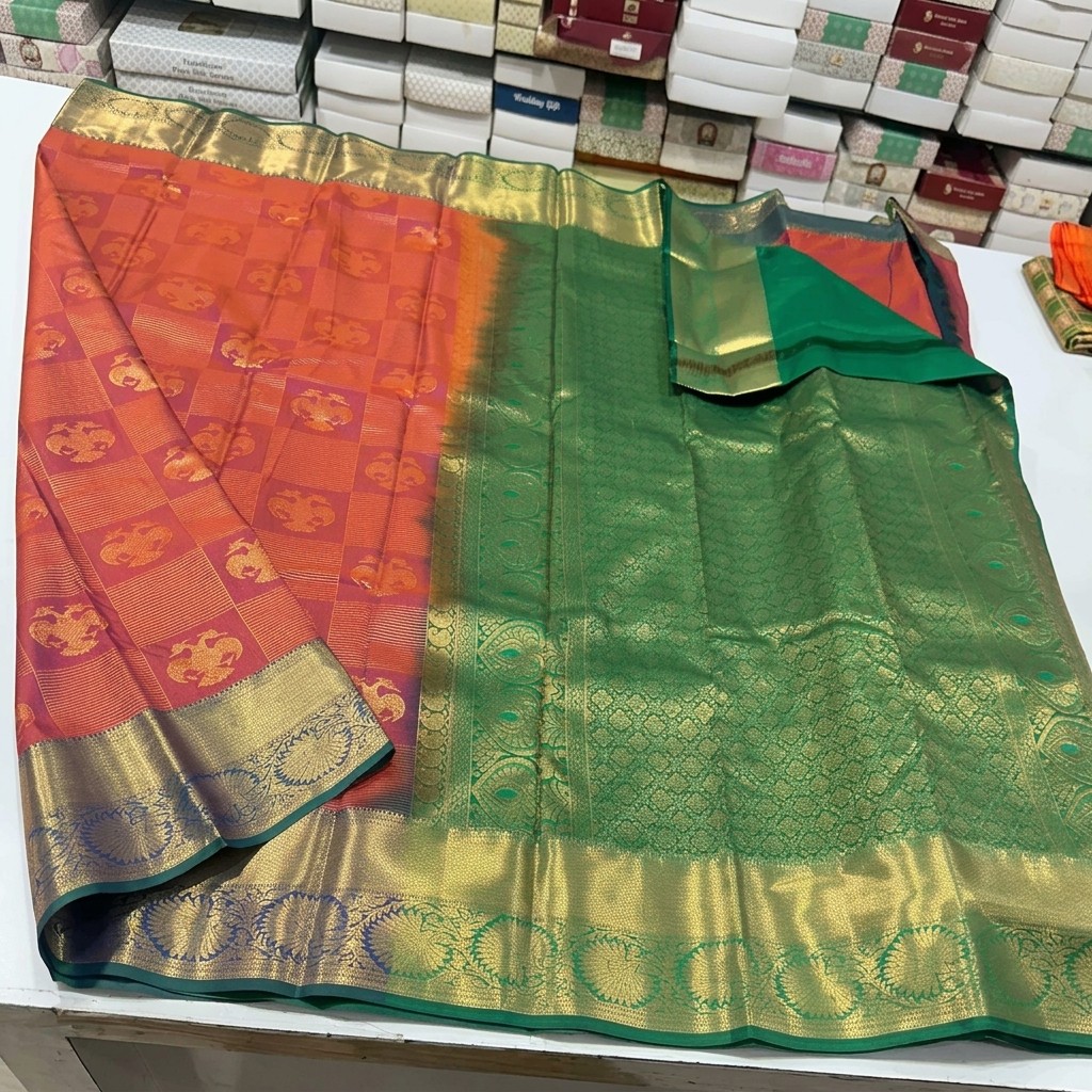 Orange and Green Semi Kanchi Pattu Saree with Golden Zari Detailing